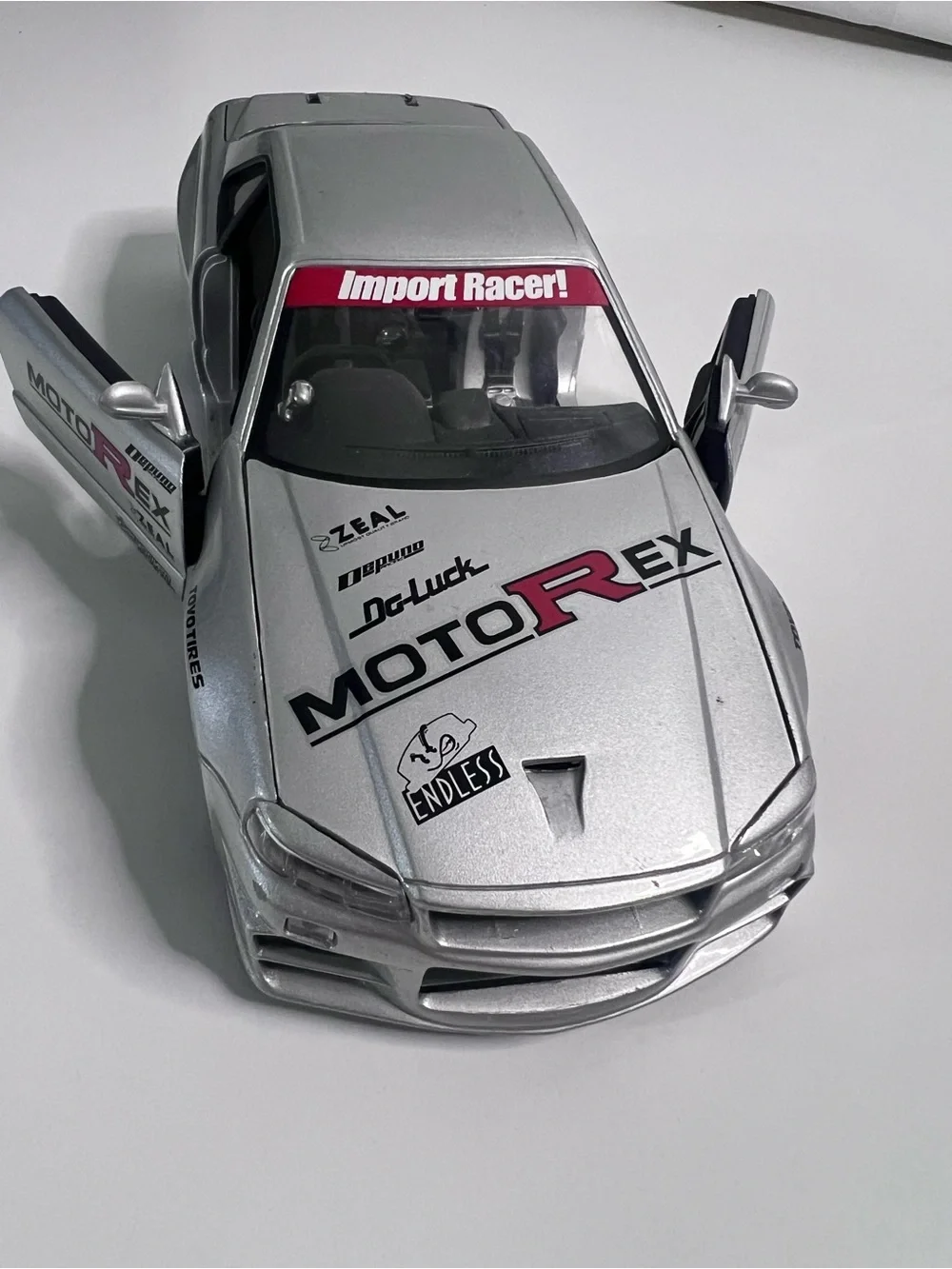 Nissan Skyline GT-R R34 Import Racer MotoRex Diecast 1:18 Escala - Coleccionable